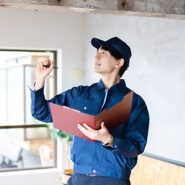 Home inspector taking notes during an inspection