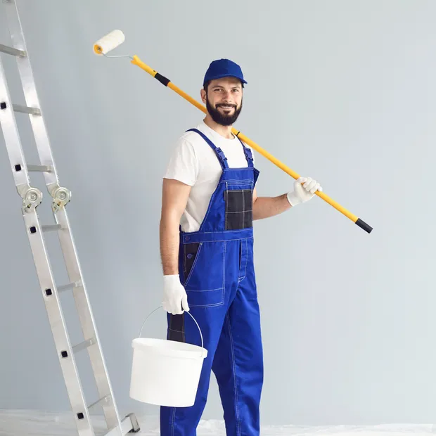 Professional painter with a roller and paint