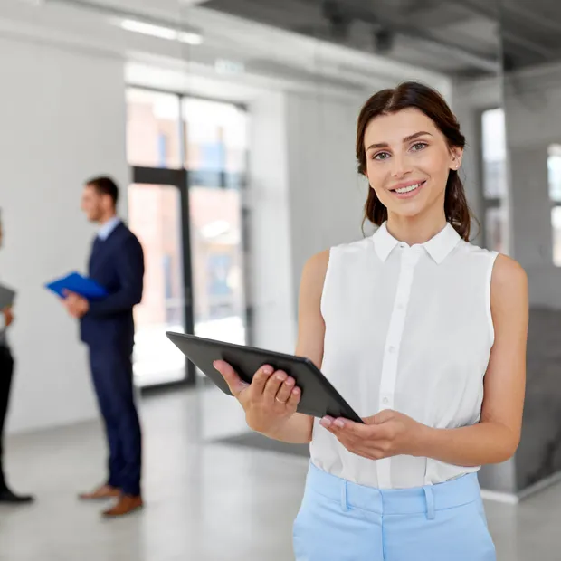 Realtor holding a tablet inside a property
